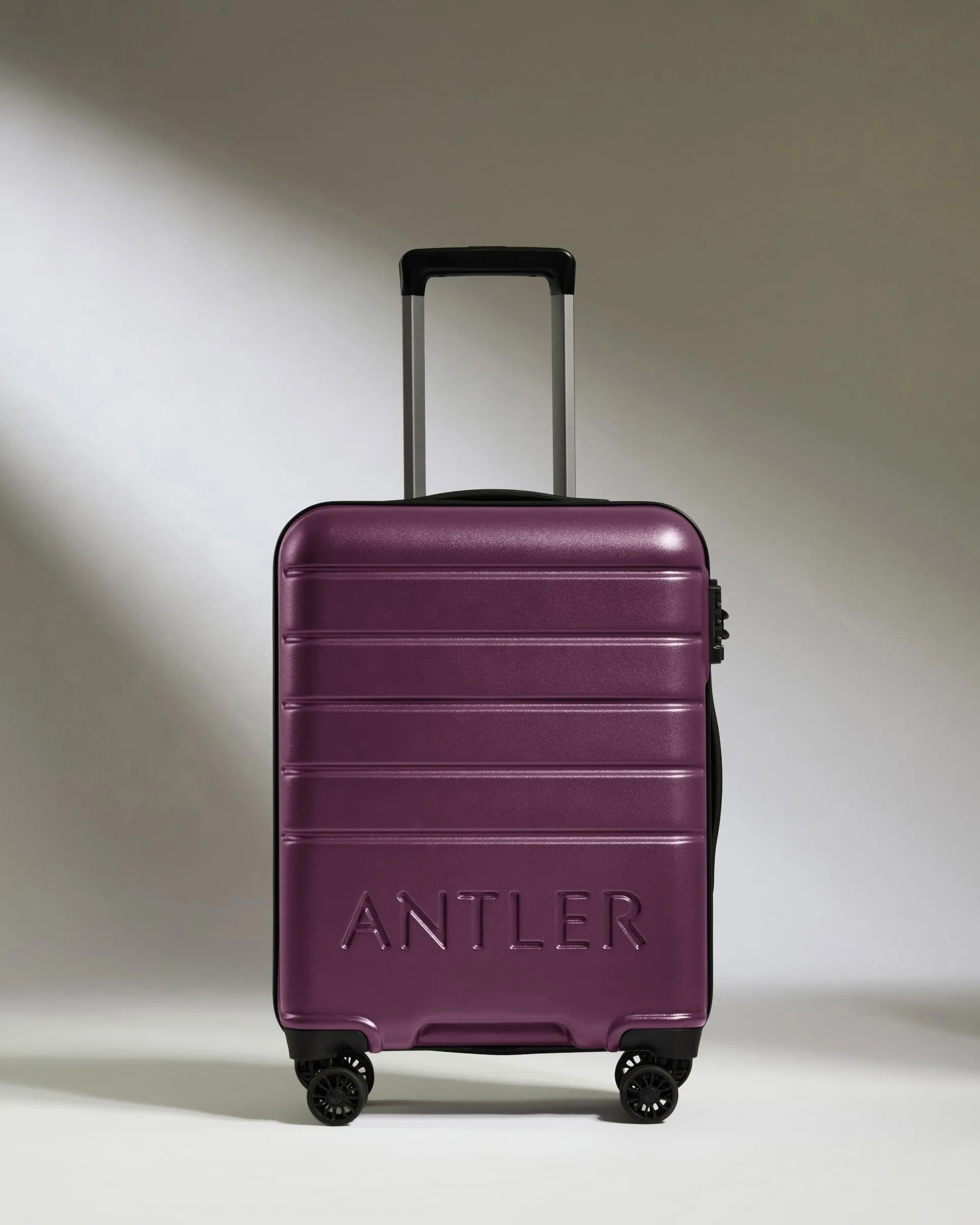 Cabin Suitcase in Dark Heather Purple - Logo