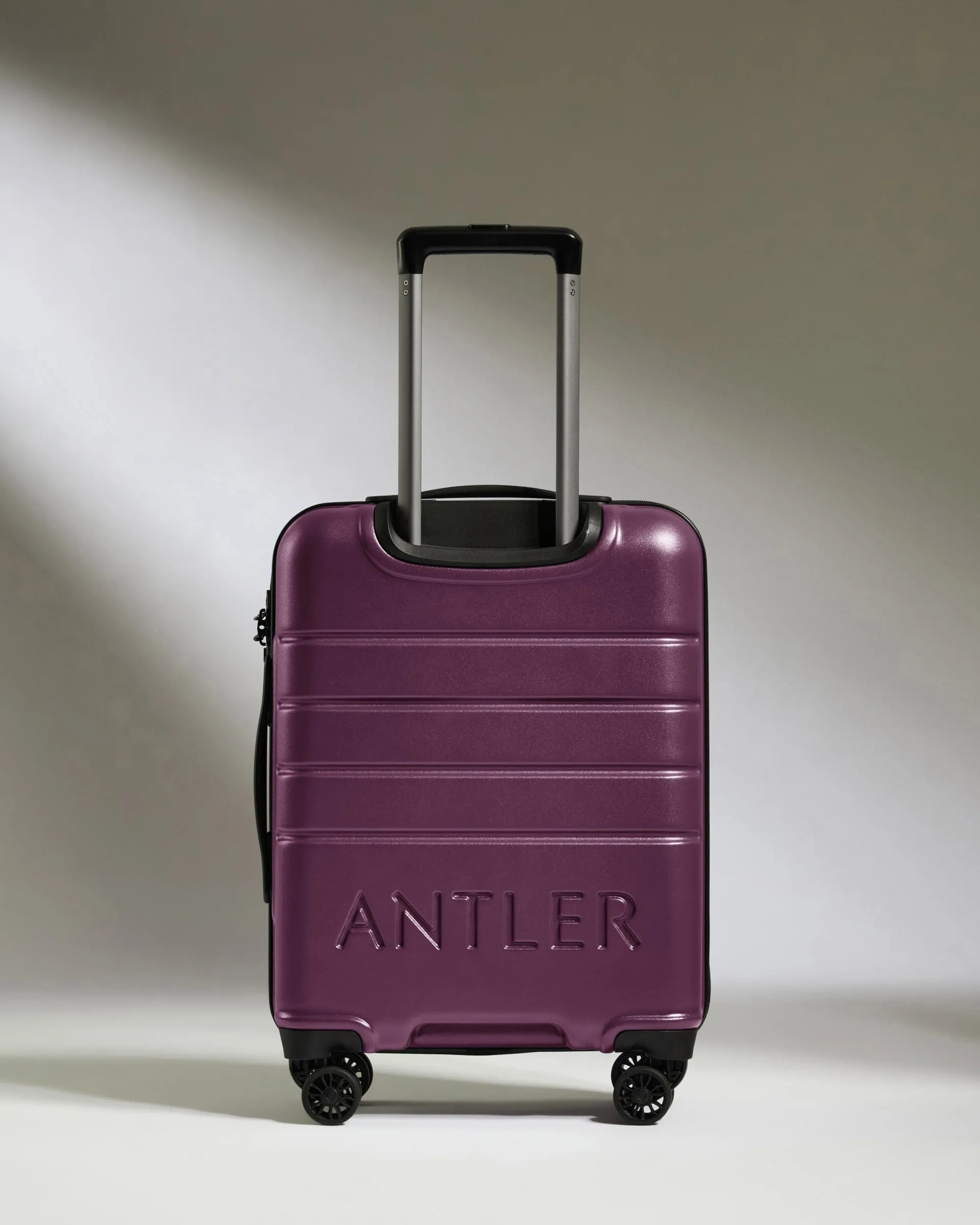 Cabin Suitcase in Dark Heather Purple - Logo