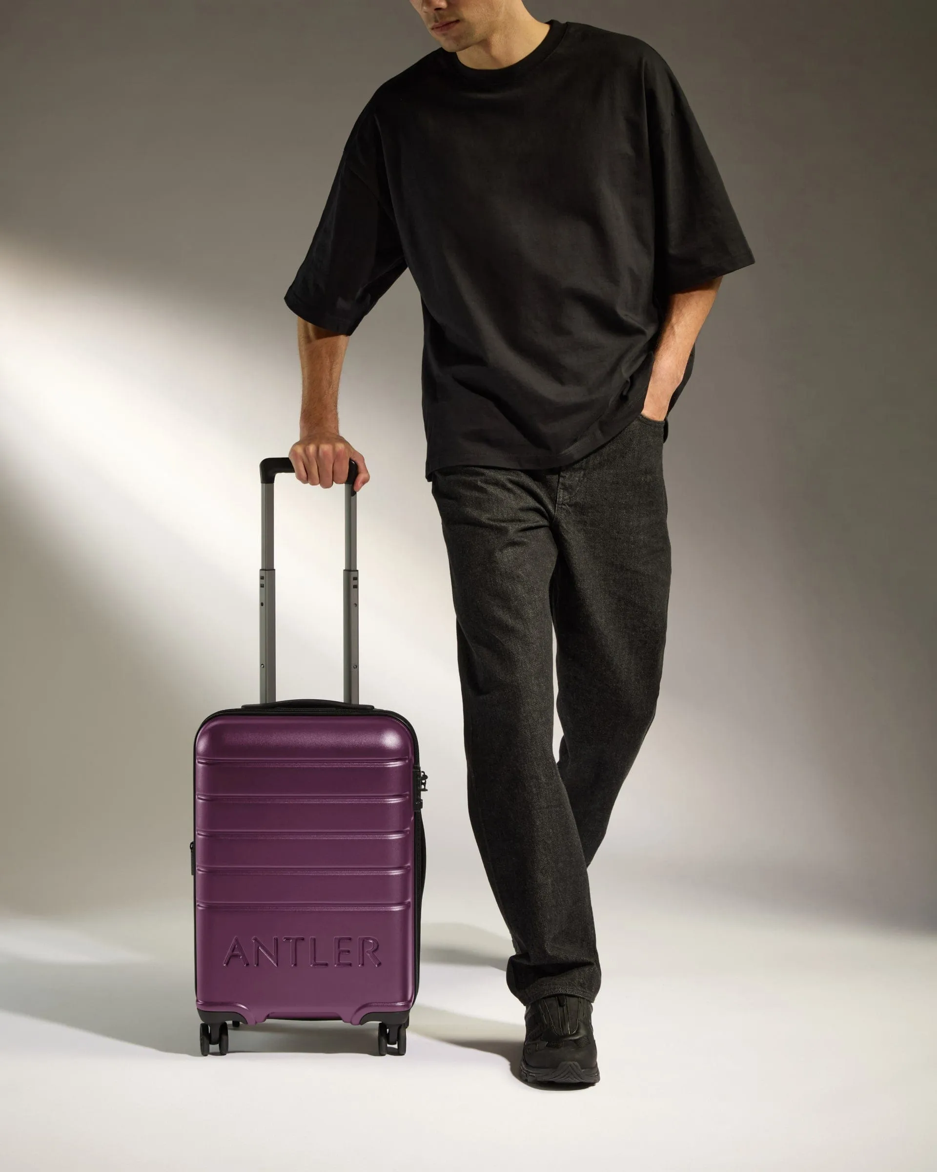 Cabin Suitcase in Dark Heather Purple - Logo