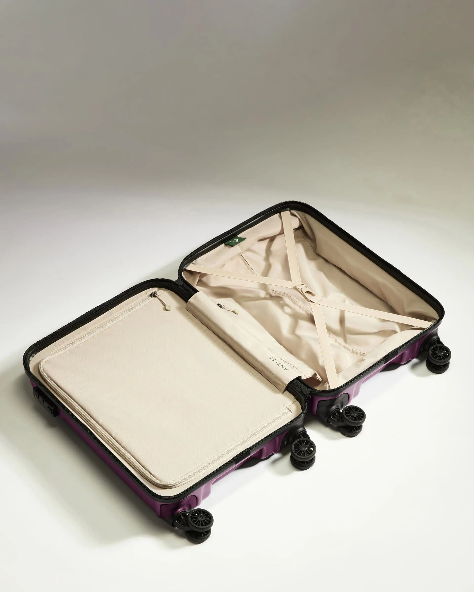 Cabin Suitcase in Dark Heather Purple - Logo