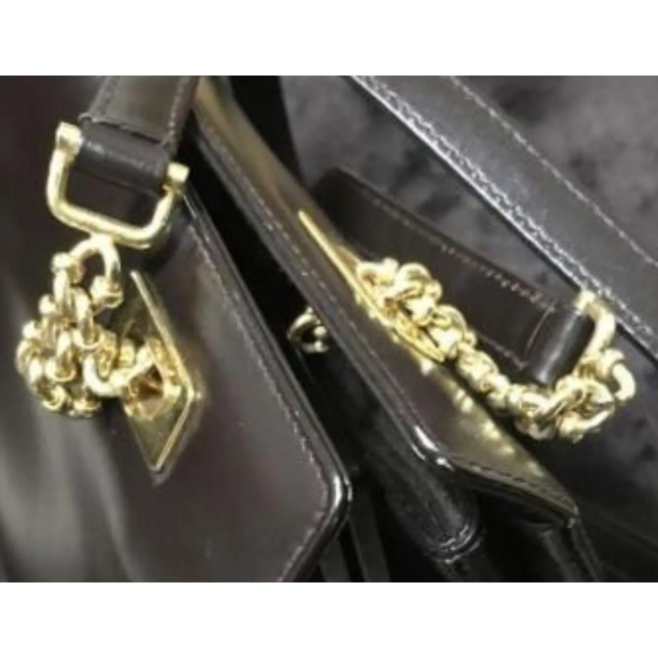 Gucci, unique, brown leather, large satchel style  shoulder bag with a snap hinged top, two longer gold chain & leather shoulder straps