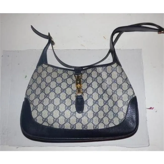 Mod, Gucci, 1961 Jackie- O style, dark blue Guccissima print coated canvas and navy leather, shoulder bag with gold piston closure and strap extender