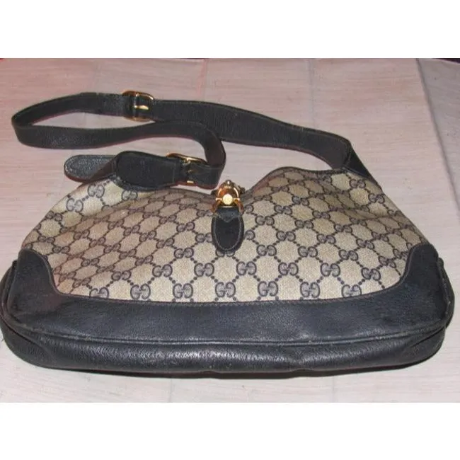 Mod, Gucci, 1961 Jackie- O style, dark blue Guccissima print coated canvas and navy leather, shoulder bag with gold piston closure and strap extender