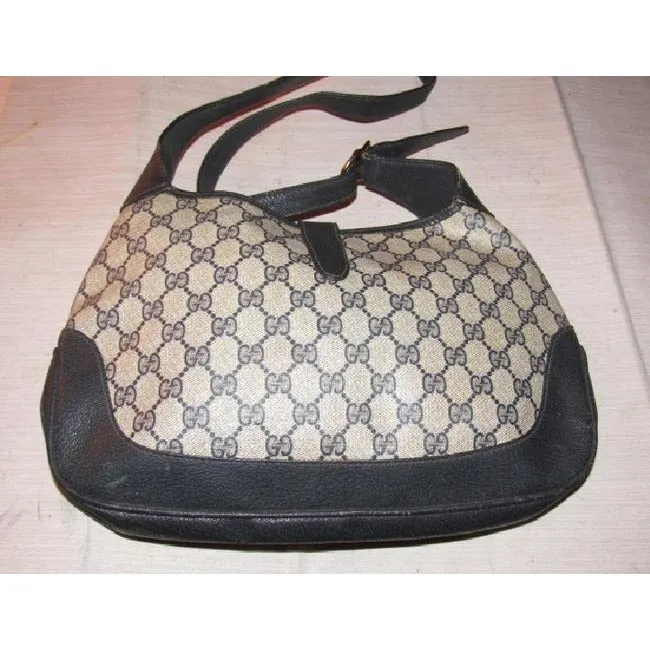 Mod, Gucci, 1961 Jackie- O style, dark blue Guccissima print coated canvas and navy leather, shoulder bag with gold piston closure and strap extender