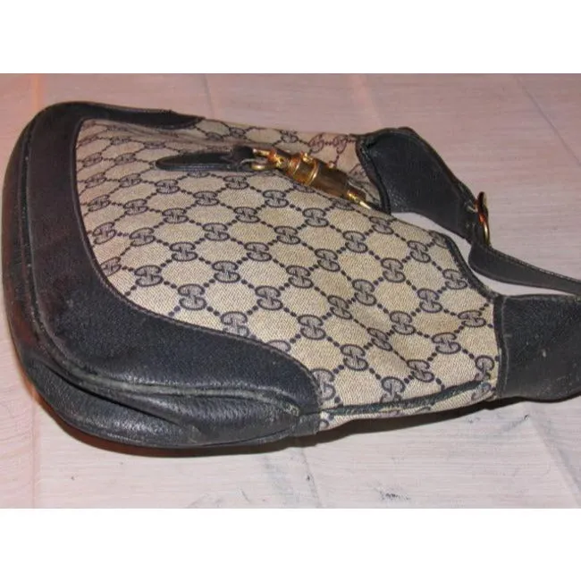 Mod, Gucci, 1961 Jackie- O style, dark blue Guccissima print coated canvas and navy leather, shoulder bag with gold piston closure and strap extender
