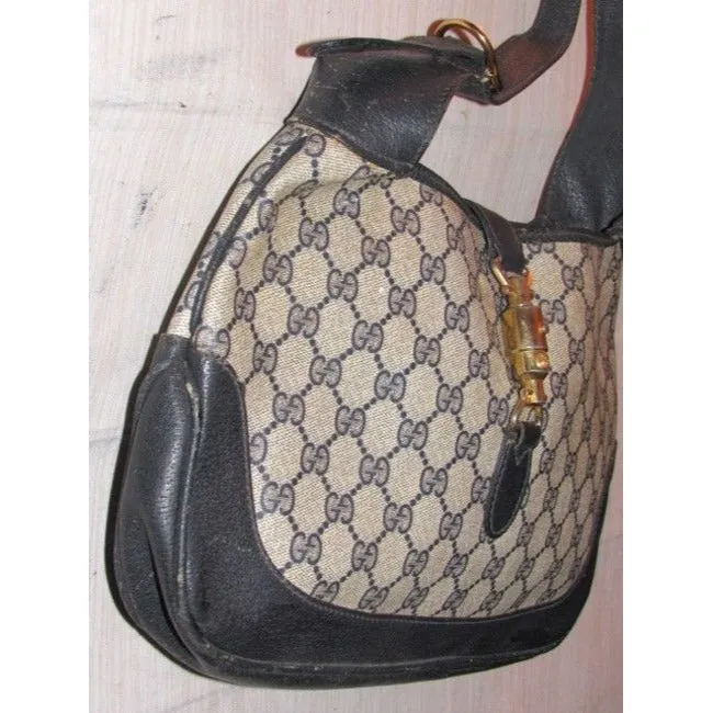 Mod, Gucci, 1961 Jackie- O style, dark blue Guccissima print coated canvas and navy leather, shoulder bag with gold piston closure and strap extender