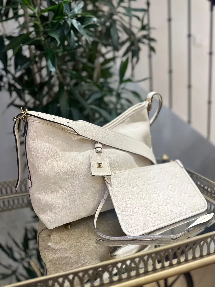Preloved Louis Vuitton Monogram Empreinte Shoulder Bag in Cream Leather